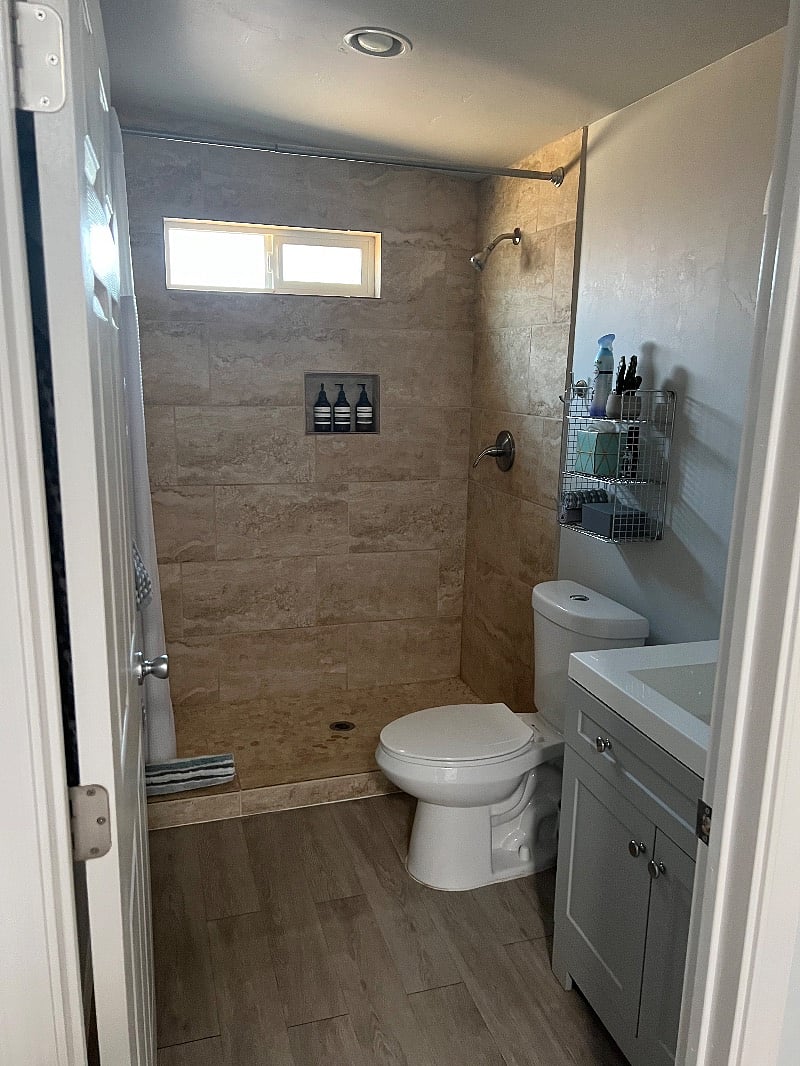 Good size bathroom with large Travertine Shower.