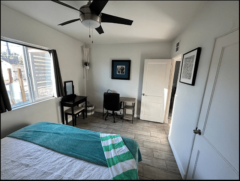 King bedroom with desk.