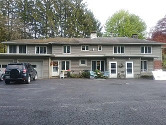 % unit building catering to traveling professionals. This unit is on ground floor with blue chairs in front. Parking is directly in front .