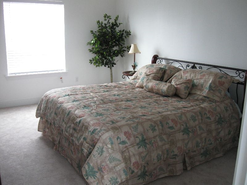 Large bedroom upstairs with king bed