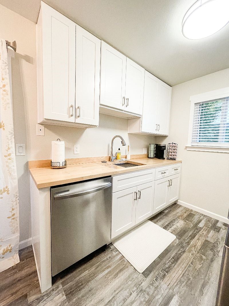 Left side of kitchen.