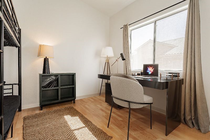 Virtually staged. Desk and chair available or roll away bed.