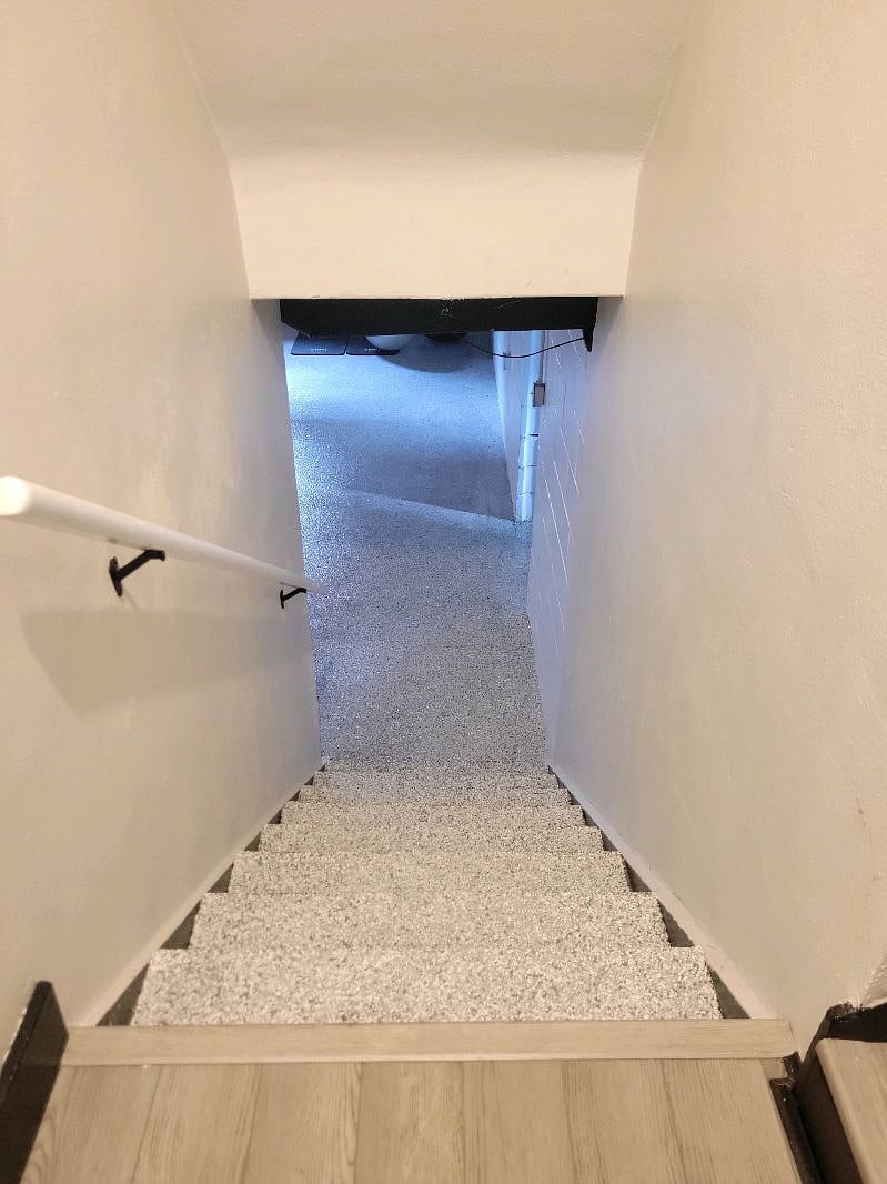 Stairway to lower level (laundry & exercise room)