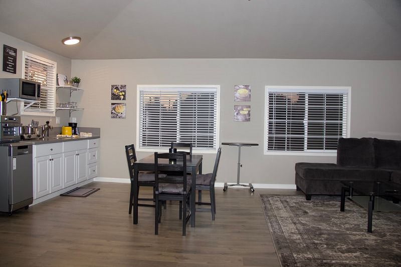 view towards kitchen and dining, 3 windows, kitchen and great room