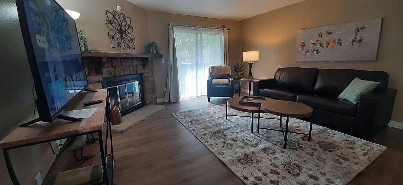 Large living room with patio access and duck pond view.
