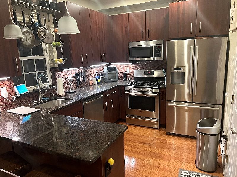 Kitchen - fully stocked with air fryer, ice/water machine in fridge, microwave, oven/range, pots and pans. Coffee grinder and pour over coffee maker also included.