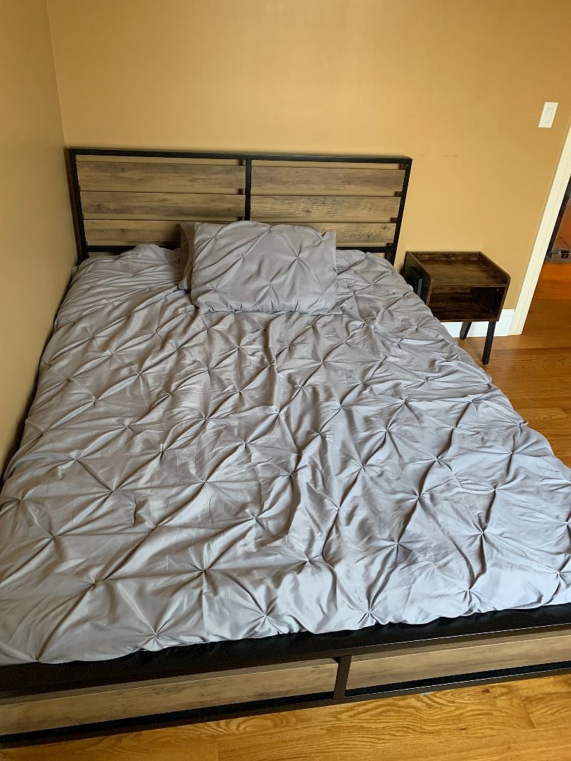 Queen Size bed, in Bedroom, with a light and night stand next to bed