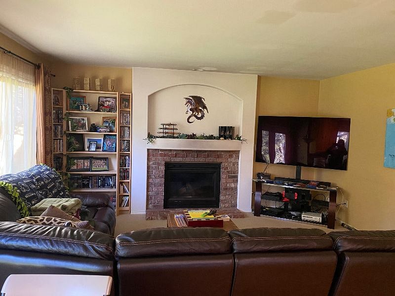60" OLED TV available with Netflix, Disney+ and Prime Video in the family room.