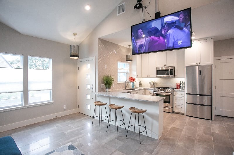 TV drops from ceiling for easy watching