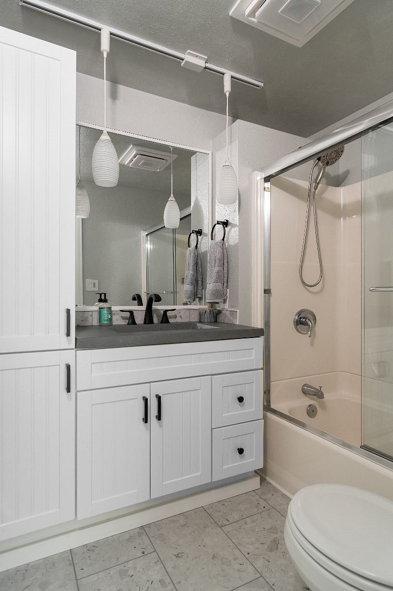 Bathroom with Enclosed Shower/Tub + Storage