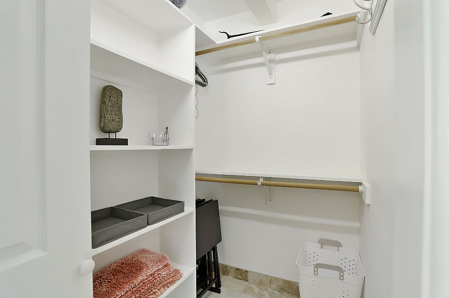 Walk-in closet in ensuite bathroom.