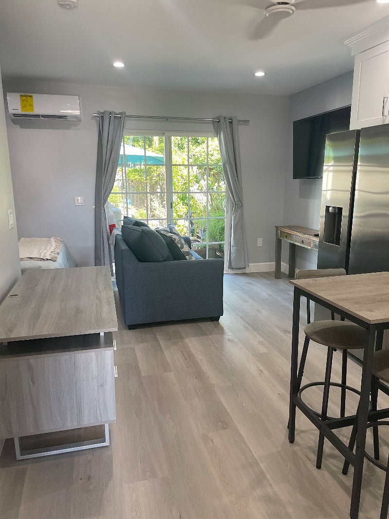 55 new smart TV and a new blue love seat. Beautiful patio outside the double doors.