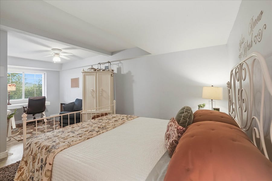 Very large bedroom with Armoire at foot of bed that has a small TV with all the channels on it... for your use while resting!
The bed is very cozy! Shades on windows help to darken the room for extra morning sleeping time!