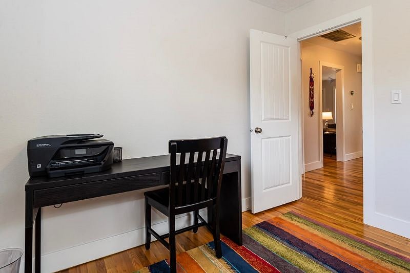 Wide desk with printer.