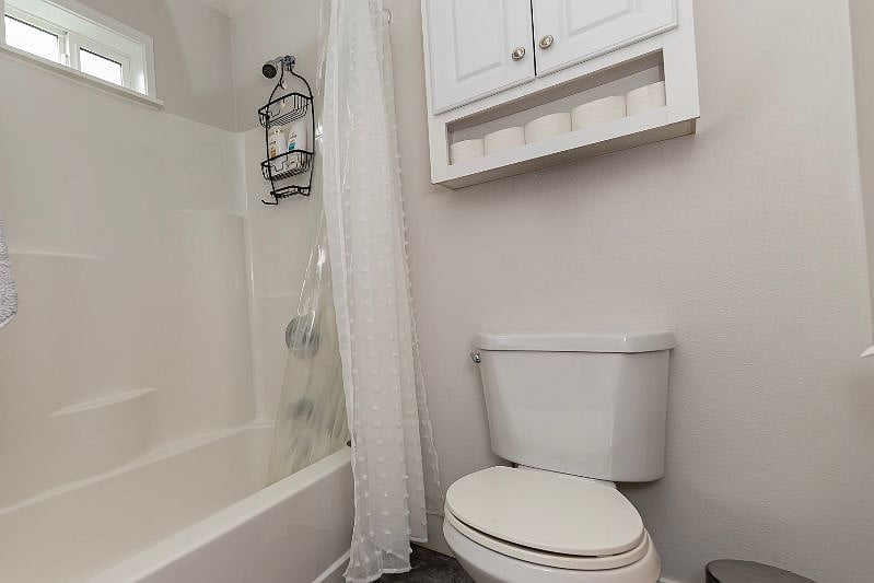 Second cabinet, tub, & shower.
