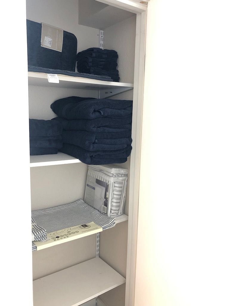 Extra towels, sheets and storage space in bathroom linen closet