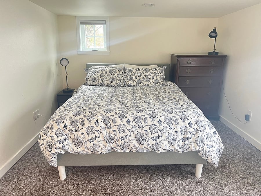 Queen sized bed with extra pillows, blankets and 2 sheet sets.