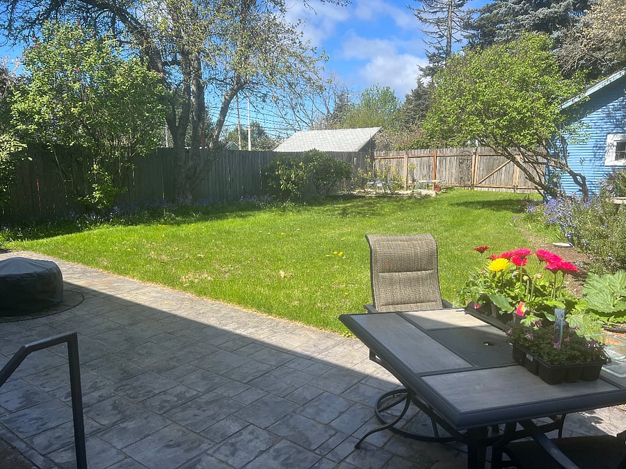 Access to back yard with table, chairs, fire pit. Alley access for easy moving in/out.