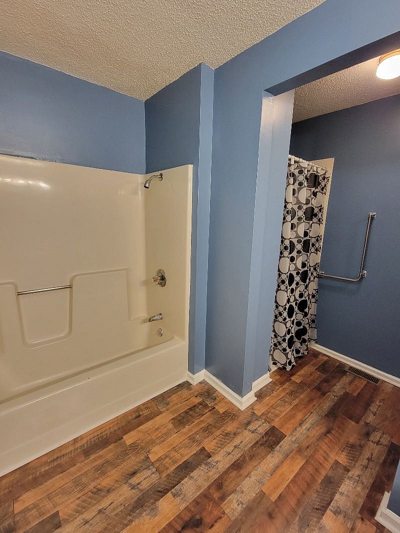 Separate shower and bath tub areas