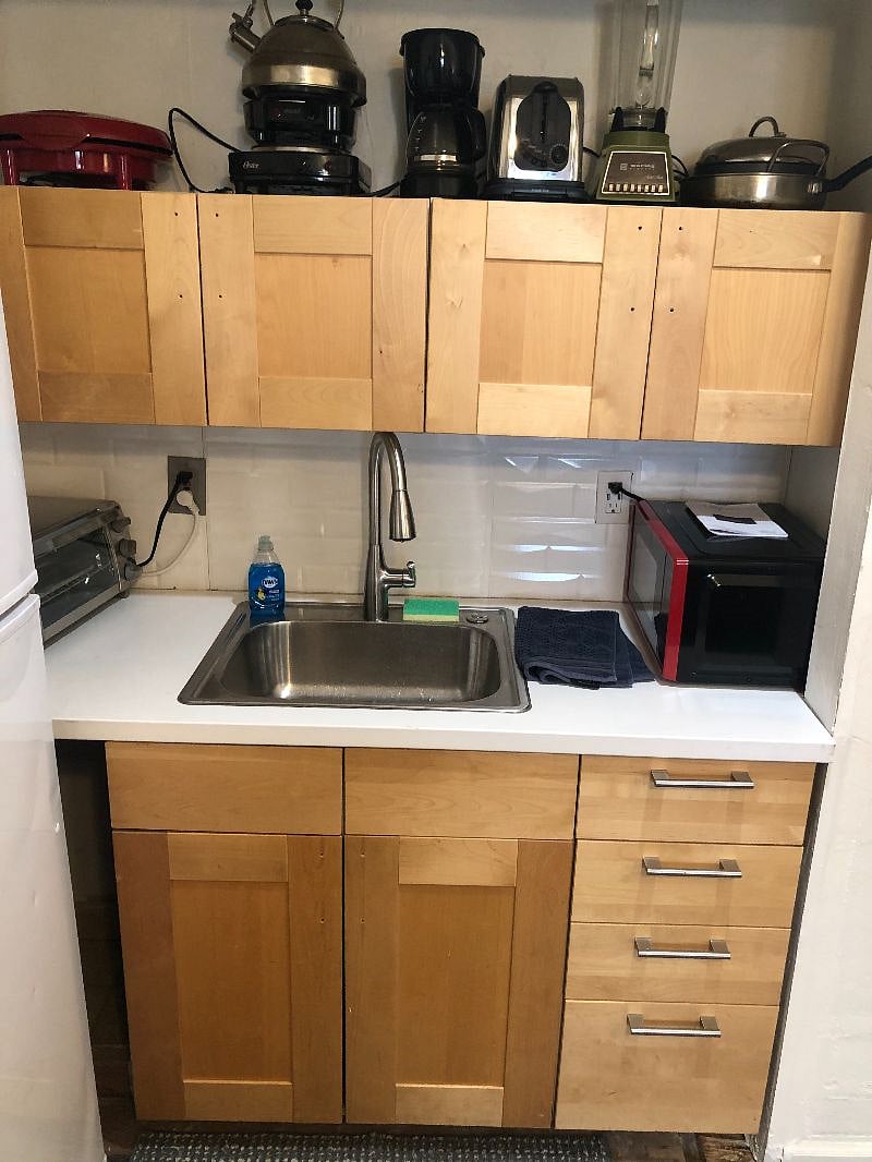 kitchen is fully stocked with dishes, pots, pans. ample cabinet space