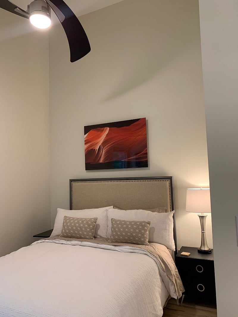 Comfy queen bed with dresser, nightstand, fan, lamp & vaulted ceiling