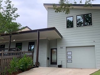 View of exterior of home. See well-lit apt door entry. Apt is over garage