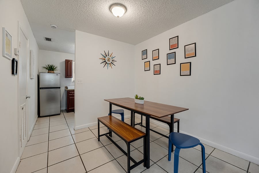 Welcoming dining area with a large table, perfect for family dinners and gatherings.