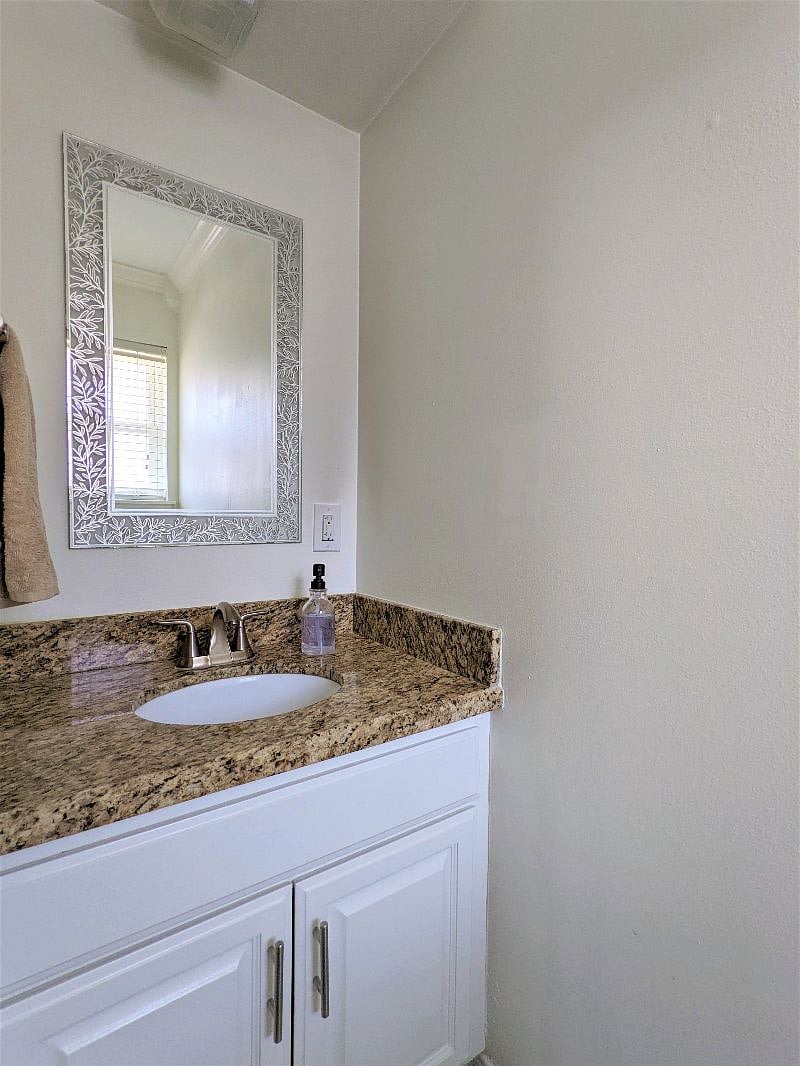 Shared space: Guest half bathroom inside utility room area