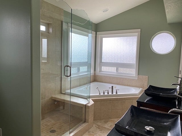 Principle Bath with Jacuzzi, large separate shower, 2 vanities, & private toilet.