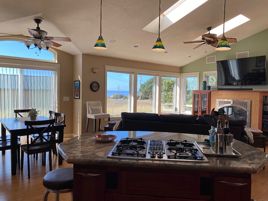 Great Room with ocean views, 60" smart tv, fireplace, very comfy leather sofa with 2 chaises, window seats, dining table with 6 chairs.
