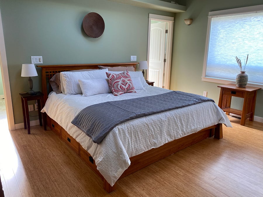 Principle Bedroom with King bed, fireplace, smart tv, large dresser, blackout shades & walk in closet.