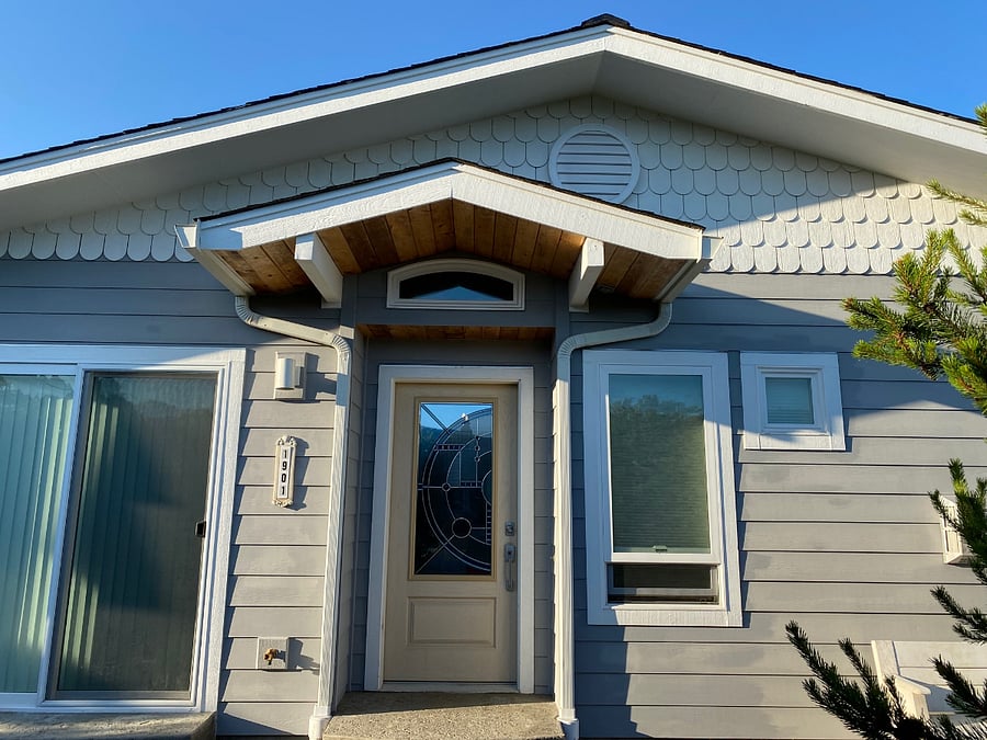 Front entry with art glass door.