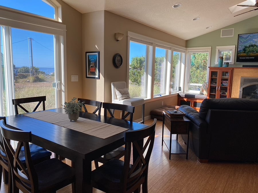 Great Room with ocean views, 60" smart tv, fireplace, very comfy leather sofa with 2 chaises, window seats, dining table with 6 chairs.