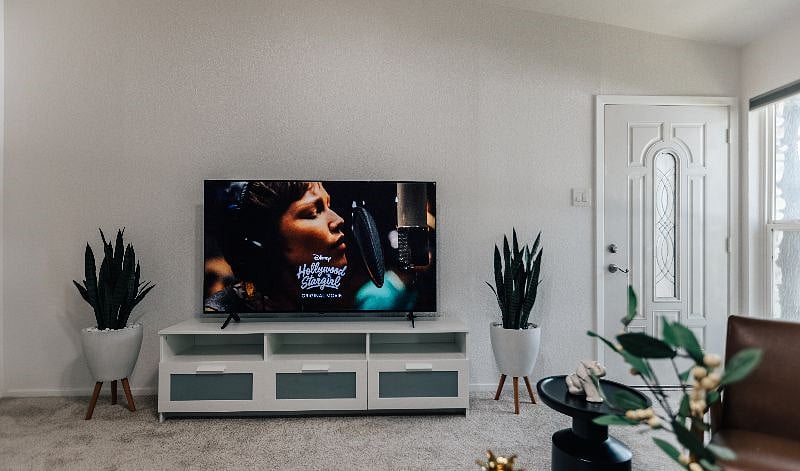 Brand new 65 inch smart TV with Netflix, Amazon Prime set up in the living room