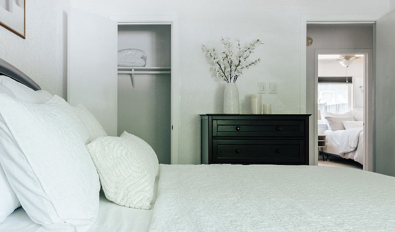 Master bedroom has a queen bed, brand new hybrid medium firm mattress, comfortable bedding and linens, two closets and a dresser for your storage.