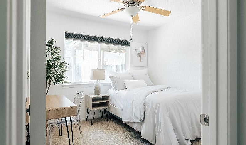 Bedroom 1 features a double bed, premium mattress, comfortable bedding and a working space