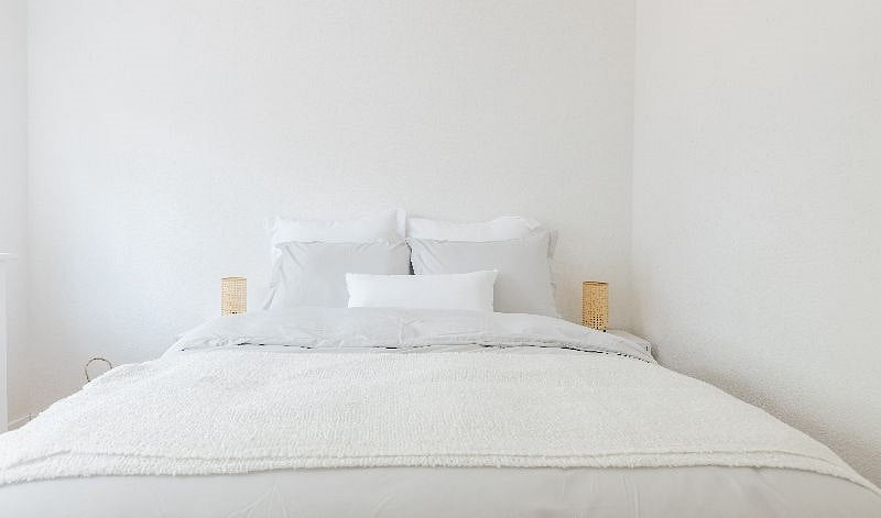 Bedroom 2 features a double bed, new hybrid medium firm mattress, comfortable bedding, beautiful Ikea dresser and a large window with view to the fountain.