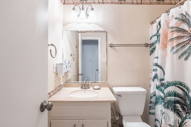 Bathroom 2 situated in the hallway is beautifully furnished and providing you with all essential toiletries.