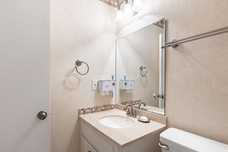 Bathroom 2 situated in the hallway is beautifully furnished and providing you with all essential toiletries.