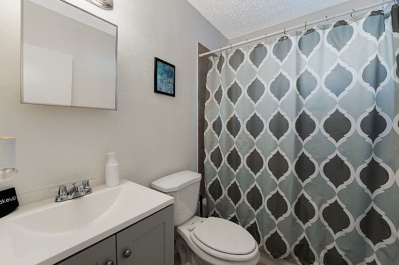 Private bathroom with clean design and natural lighting.