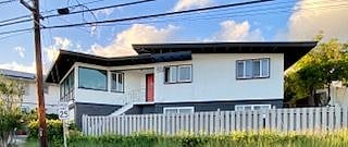 side view of our newly painted Mid Century Modern House. Apartment unit is on the first floor. Rental unit includes garage parking. 