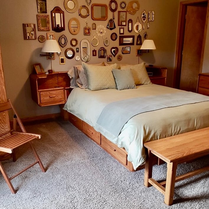 2nd Floor bedroom with queen bed. Full Bathroom door is in the photo to the left. LOTS of storage under the bed, it has plenty of drawers in the pedestal.