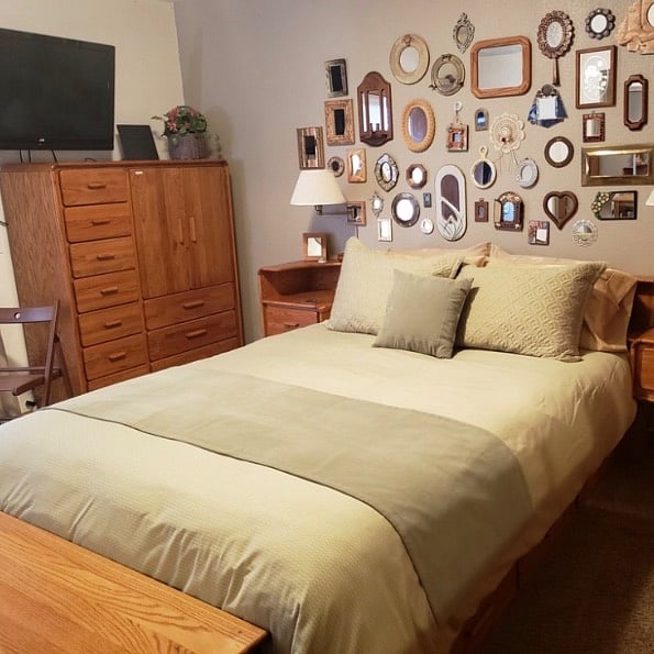 Bed headboard has convenient storage and reading lamps. Large armoire offers MORE storage! Another LARGE chest-of-drawers is on opposite side of the room with MORE storage again!