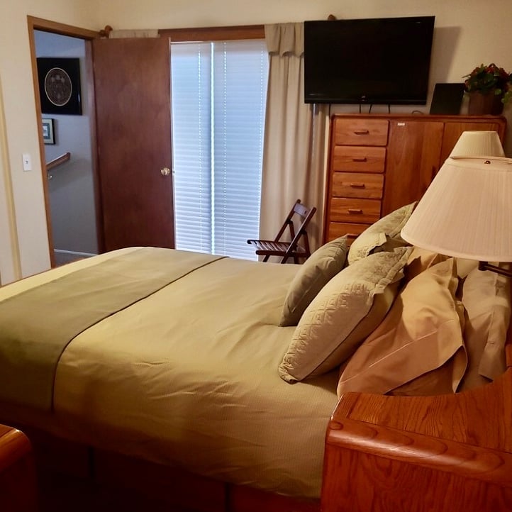Want to block out the light, duet blinds with pull across drapes add to privacy and light mitigation. Mirrored sliding closet doors at the end of the bed give LOTS of hanging clothes storage.