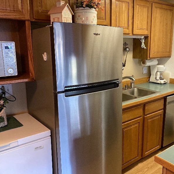 Full sized refrigerator, coffee maker and plenty of pots and pans, plus other cooking essentials and utensils.