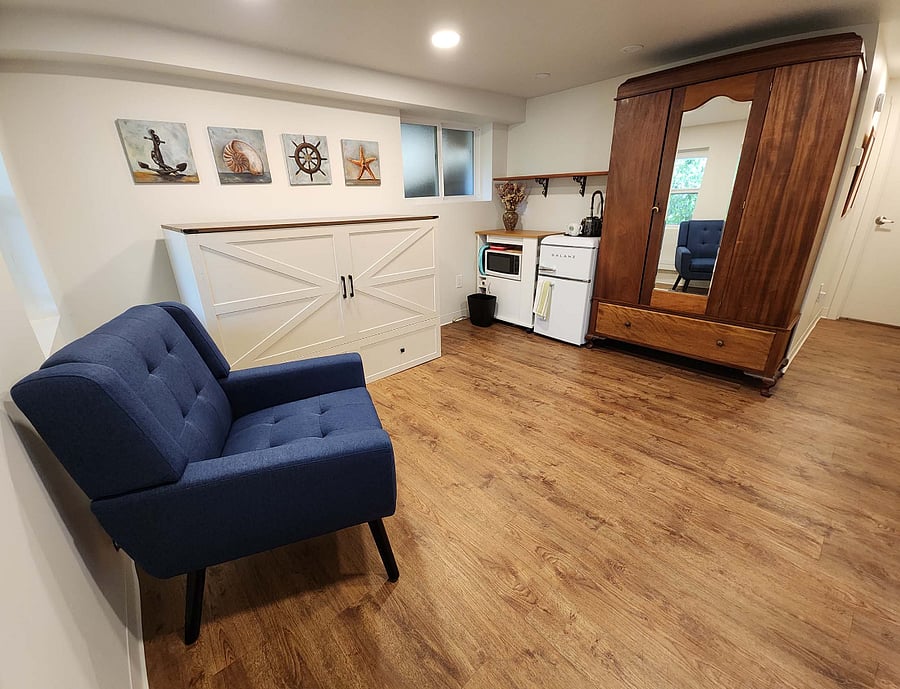 LIVING/SLEEPING/KITCHENETTE WITH ANTIQUE ARMOIRE