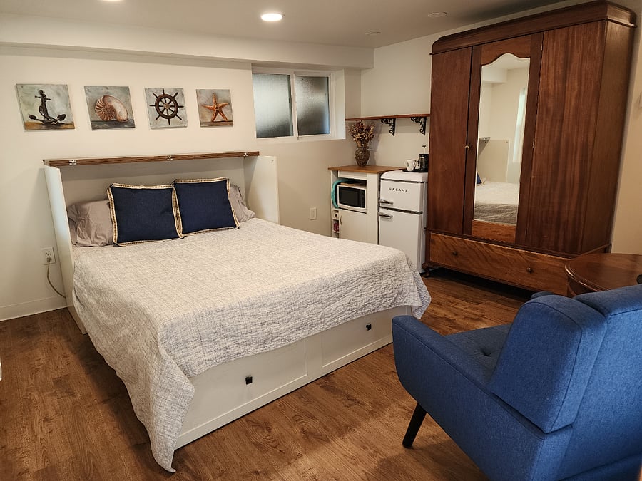LIVING/SLEEPING (QUEEN BED)/KITCHENETTE & ANTIQUE ARMOIRE