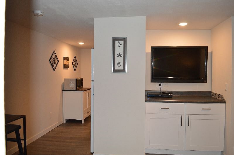 View from entry into kitchen & living room alcove