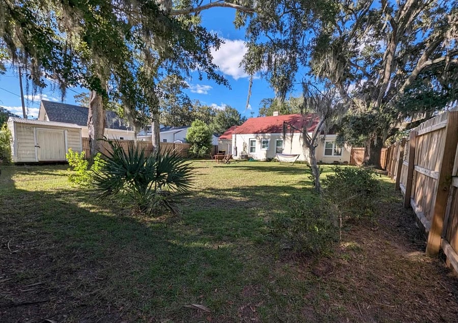 Spacious rear yard with privacy fence all around. Three secured points of entry.