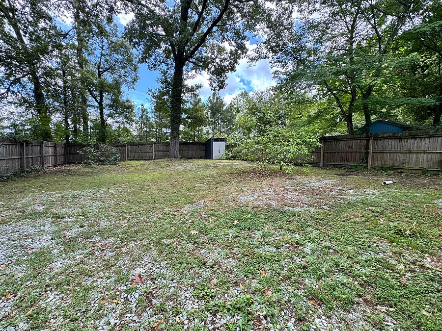 Spacious fully fenced backyard.